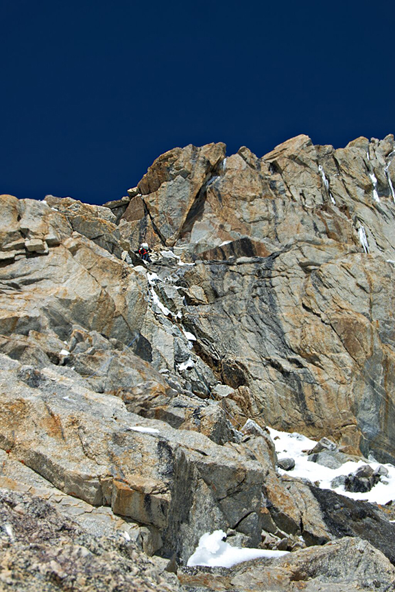 A climber on a difficult rock wall